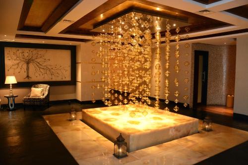 a bedroom with a large bed in a room at Sofitel Mumbai BKC in Mumbai