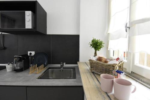 a kitchen with a sink and a counter top at La Casa di Oreno in Vimercate