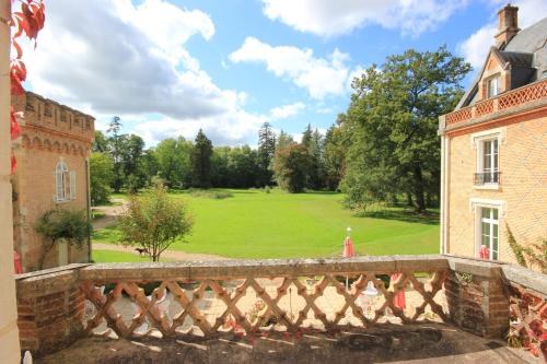 a view of a golf course from a bridge at Hostellerie Du Château Les Muids in La Ferté-Saint-Aubin