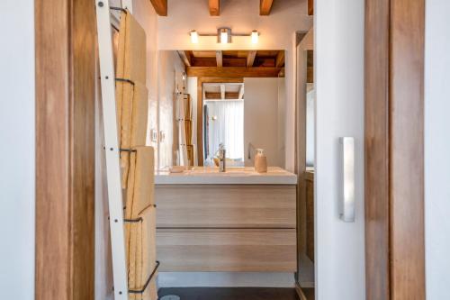 a bathroom with a sink and a mirror at El Loft in Famara