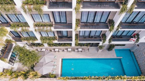 an overhead view of an apartment building with a swimming pool at Angkor Aurora in Siem Reap