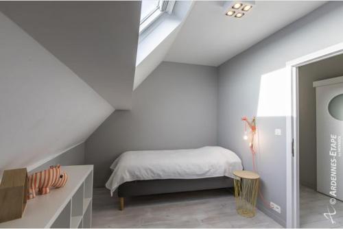 Кровать или кровати в номере Gites de la Costerie