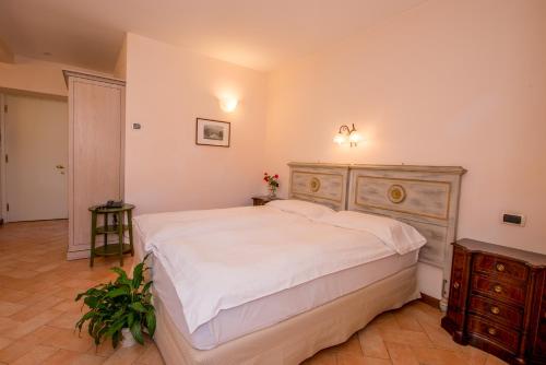 En eller flere senge i et værelse på Residence la Limonera