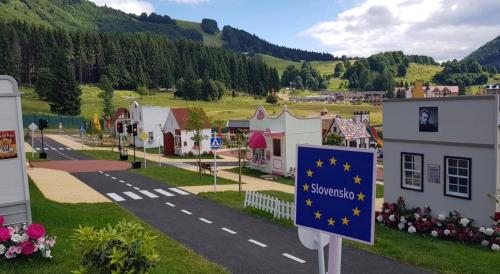 a small town with a sign on the side of a road at Apartman Mama Donovaly in Donovaly