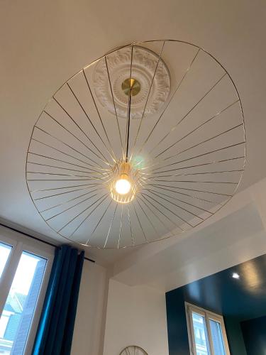 a large fan hanging from a ceiling at PARENTHESE - Le Vignemale in Lourdes
