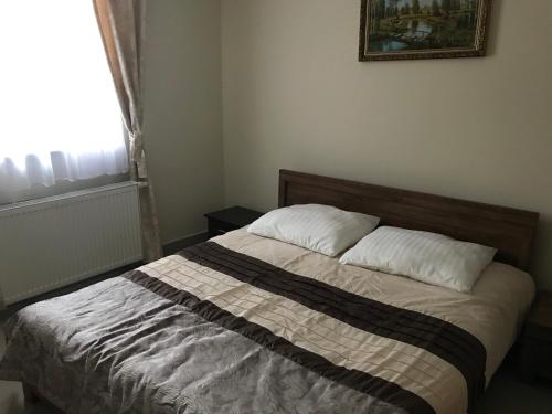 Ένα ή περισσότερα κρεβάτια σε δωμάτιο στο Apartamenty Mieszkaniowe Kadrema