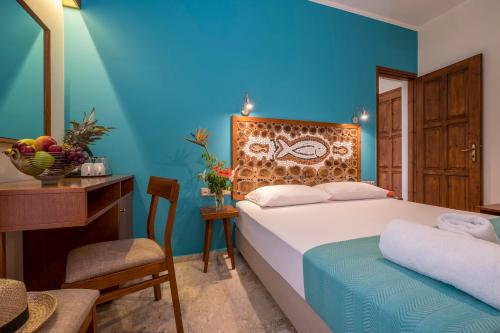 Postel nebo postele na pokoji v ubytování Aris Boutique Hotel