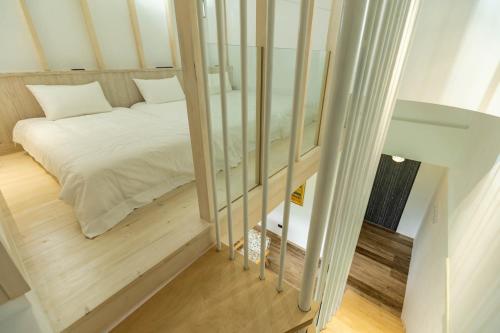 Cama o camas de una habitación en 靜樹湖民宿Jing Shuhu B&B