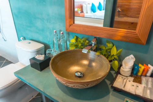 a bathroom with a copper sink on a counter at Angkor Aurora in Siem Reap