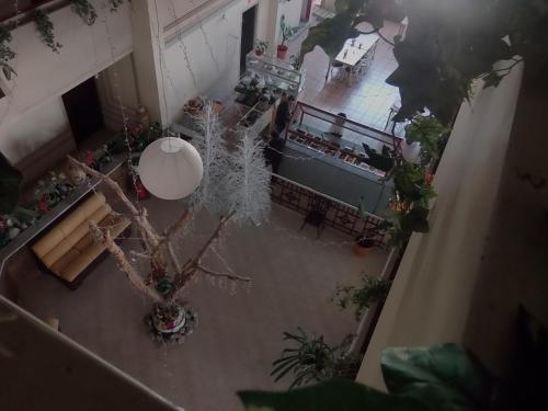 an overhead view of a living room with a christmas tree at Hotel Raldos Inn in Salamanca