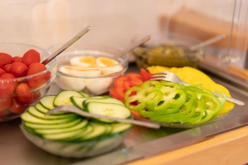 a bunch of fruits and vegetables on a counter at Hotel Garni Oasis Loipersdorf in Jennersdorf