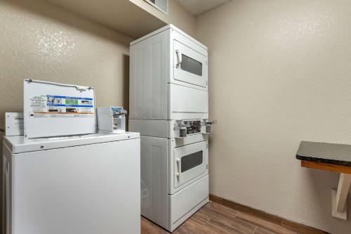 a white refrigerator and a freezer in a room at Quality Inn in Creston