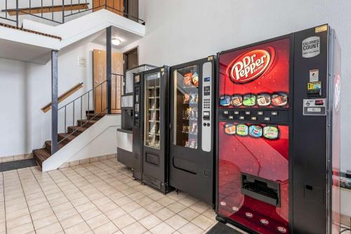 a coca cola vending machine next to a staircase at Quality Inn in Creston
