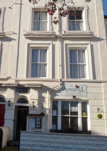 a white building with a sign in front of it at Admiral Guest House in Scarborough