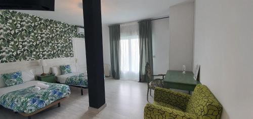 Katil atau katil-katil dalam bilik di Hostal Escala Suites