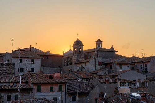 a view of a city at sunset at La Terrazza in Tuscania