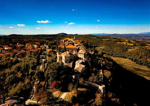 an aerial view of a village in the hills at LaChiusa Tuscany in Montefollonico