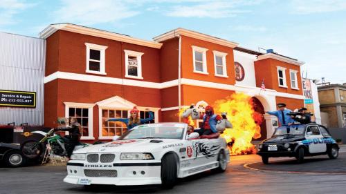 a white car on fire in front of a building at Holiday Inn Express Oberhausen by IHG in Oberhausen