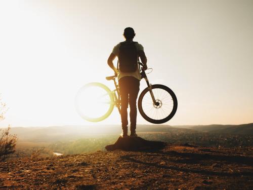 a man holding a bike on top of a hill at Villa Hardegg in Hardegg