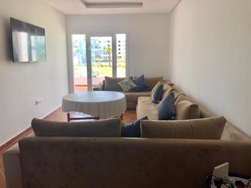 a living room with a couch and a table at Brand new Beautiful Vacation house - Family Only in Cabo Negro