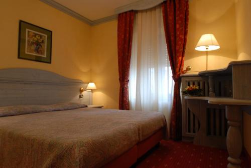 Cama o camas de una habitación en Hotel Alpi - Foza