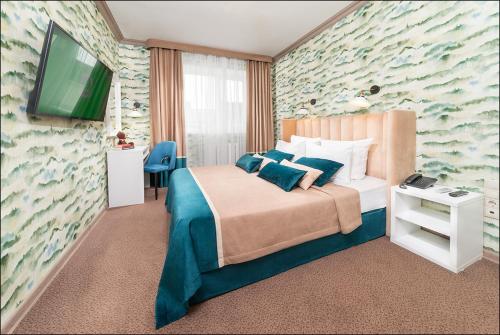 Voodi või voodid majutusasutuse Albatros Hotel toas