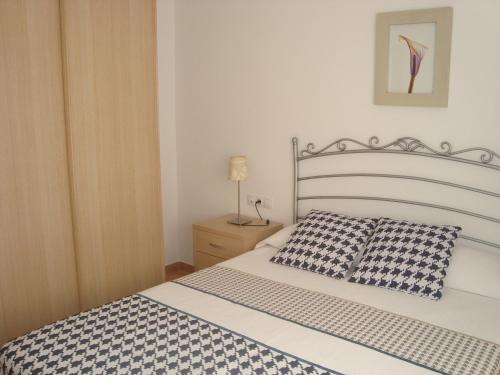 Postel nebo postele na pokoji v ubytování Apartamentos Sotavento Carboneras