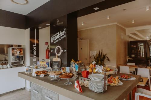 a buffet of food on a counter in a kitchen at Halanus Hotel And Resort in Alanno