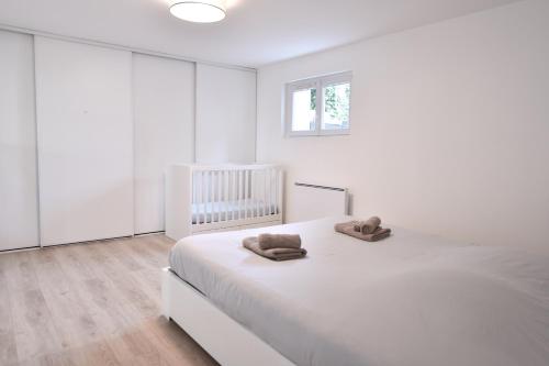 Кровать или кровати в номере 2 pièces indépendant dans maison familiale - One bedroom apartment - Family friendly