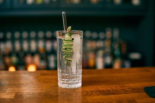 a glass of water sitting on a table at Fuchsbau Romantik Hotel & SPA Restaurant & FOX Bar in Timmendorfer Strand