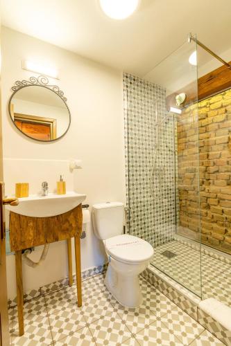 a bathroom with a toilet and a sink and a shower at Wood House Republicii in Braşov