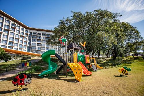 a park with a playground with a slide at Novotel Itu Terras de São José Golf & Resort in Itu