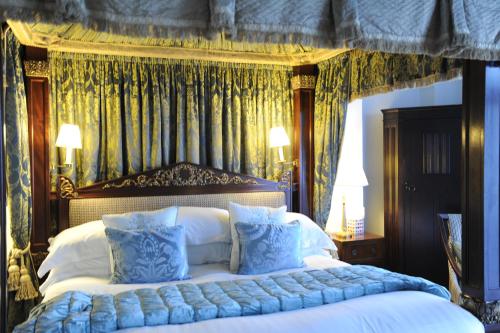 a bed that has a canopy over it at Anacapri in Falmouth
