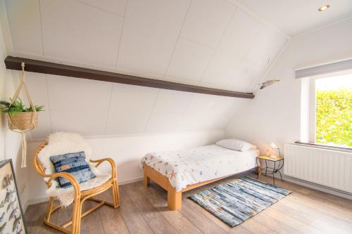 Postel nebo postele na pokoji v ubytování Vakantiehuis Vieverdwas - Yerseke