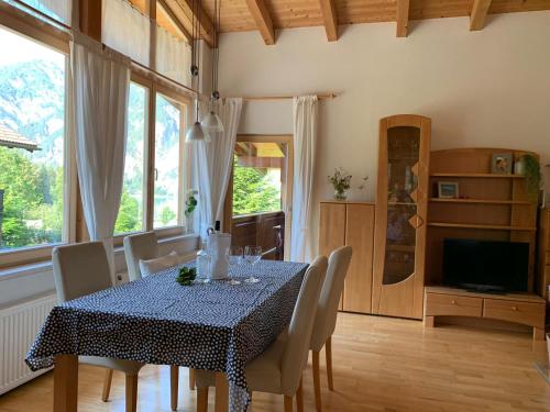 a dining room with a table and chairs at Haus Huberta in Achenkirch