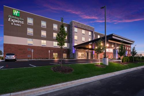 a rendering of a hotel building with a parking lot at Holiday Inn Express & Suites Chicago - Hoffman Estates, an IHG Hotel in Hoffman Estates