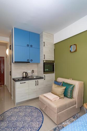 a living room with a couch and a kitchen at Sea&Center Lux in Bar