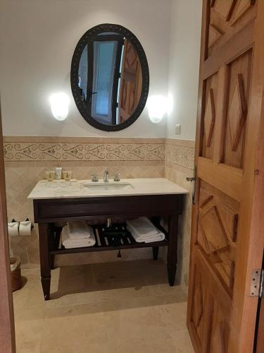 a bathroom with a sink and a mirror at Hotel La Casona De Yucay Valle Sagrado in Urubamba