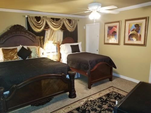 a bedroom with two beds and a ceiling fan at ONE OF THE BEST BARGAINS IN TOWN 50.00 A DAY in Montgomery