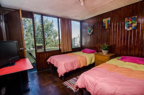 Postel nebo postele na pokoji v ubytování Arequipay Hostel