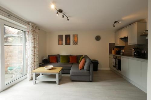 a living room with a couch and a table at Crewe Short Lets 8 Victoria Court, Crewe in Crewe