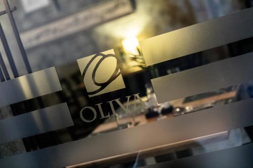 a close up of a window with a sign on it at Oliva Hotel in Veszprém