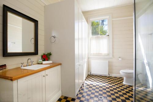 a bathroom with a sink and a toilet at Heathmont in Blackheath