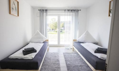 Cama o camas de una habitación en Modern Apartment with a balcony in Büsingen am Hochrhein