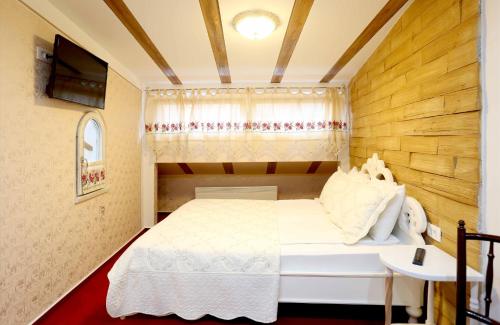 Hotel Lula tesisinde bir odada yatak veya yataklar