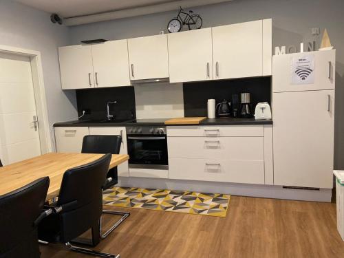 Kuchyň nebo kuchyňský kout v ubytování CITY MARITIME APARTMENT