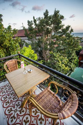 a wooden table and chairs on a balcony at Garden House Hotel - Special Class in Istanbul