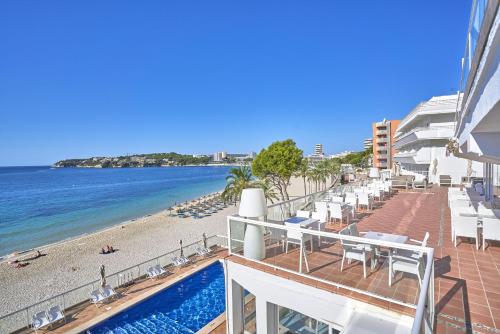 a view of the beach from the balcony of a resort at Flamboyan Caribe Hotel & Spa in Magaluf