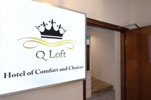 a sign for a hotel of comfort and choices at Q Loft Hotels at Bedok in Singapore