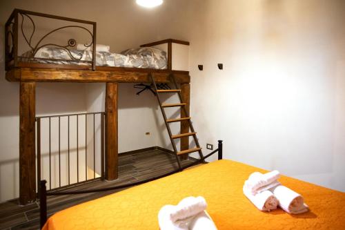 a room with a bunk bed with a ladder on it at Fardella 250 in Trapani
